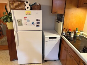 A kitchen with a refrigerator, a microwave, and a countertop with various food items. - Clean large space in Upscale Stow. Near KSU, Akron U, Akron and Cuyahoga Valley. (Stow)