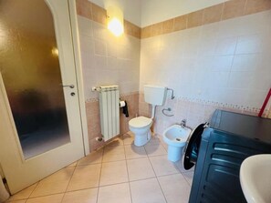 A bathroom with a toilet, bidet, and a sink. - New Listing (Sanremo)
