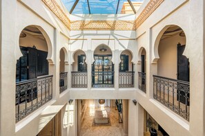 A multi-level interior with arched doorways and a central open space. - New Listing (Marrakech)