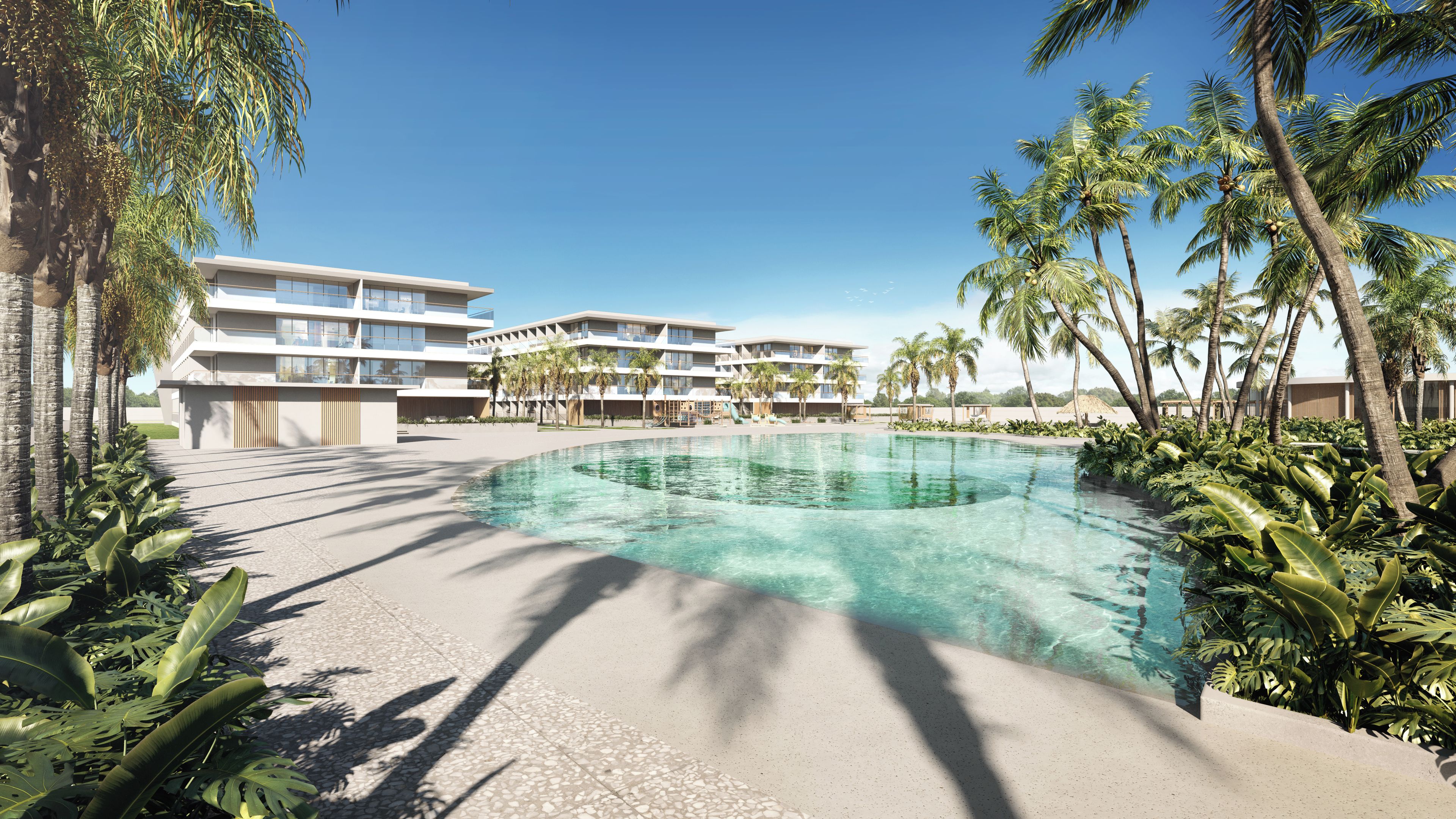 Un complexe hôtelier doté d’une piscine, de palmiers et de bâtiments modernes.