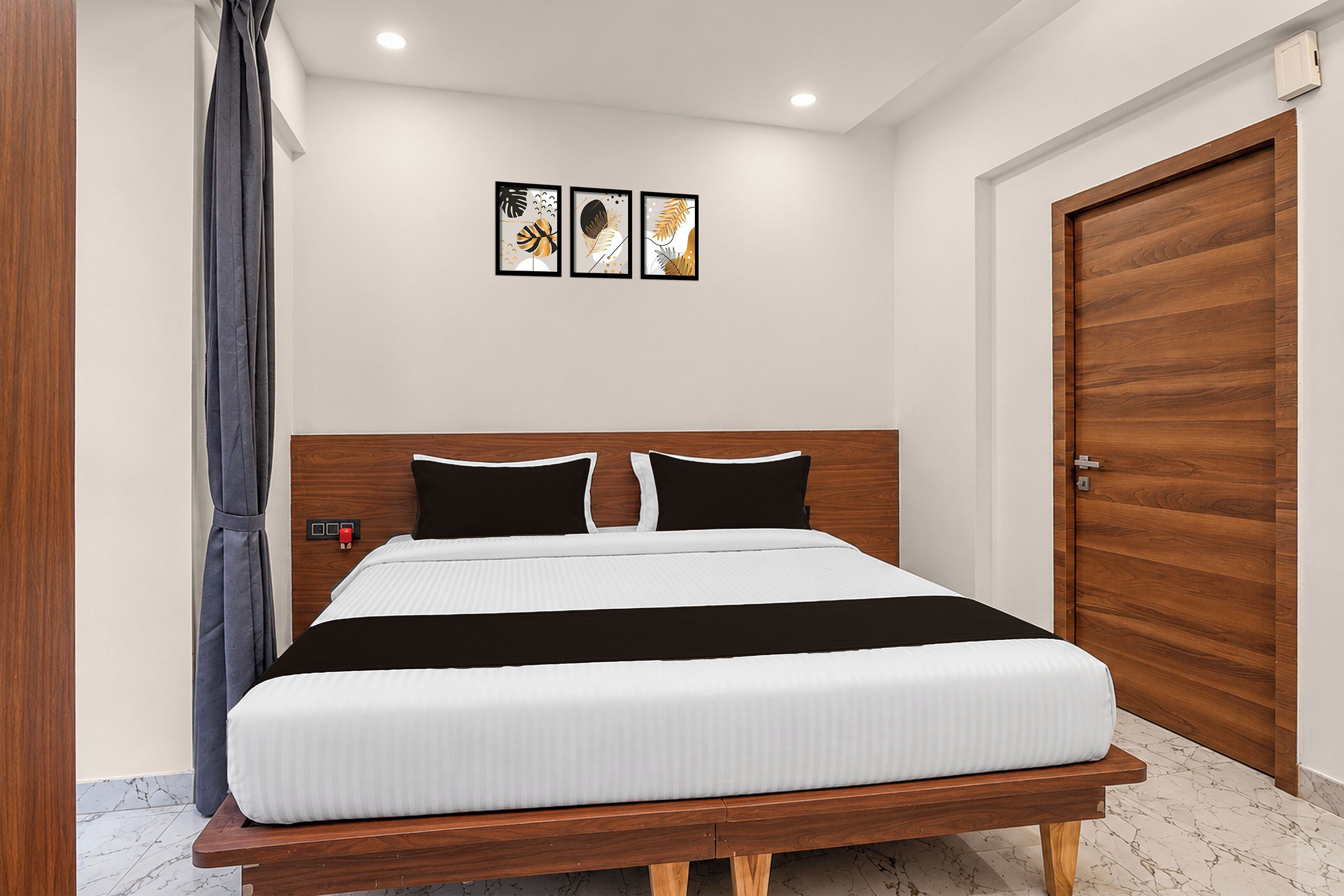 A modern bedroom with a wooden headboard, a bed with white bedding, and a wooden wardrobe.