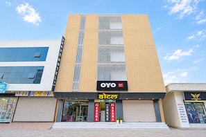 A hotel with a modern facade, featuring a prominent sign for 'OYO Hotel Shree' and 'AC ROOMS' indicating available accommodations. - Hotel O Shree Hotel (Rewari)
