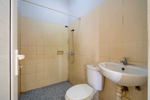A small bathroom with a toilet, a sink, and a shower. - 77 Guest House By ARBA (Kabupaten Tangerang)