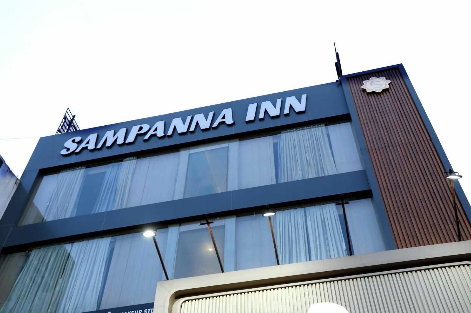 A building with the sign 'SAMPANNA INN' indicating a hotel.