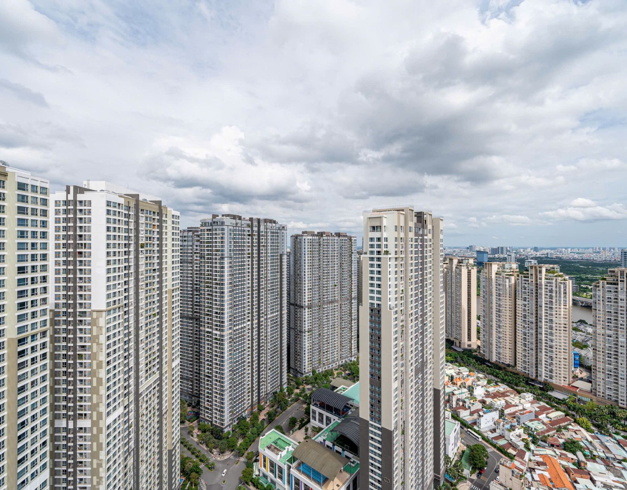 A high-rise residential area with multiple apartment buildings, roads, and greenery.