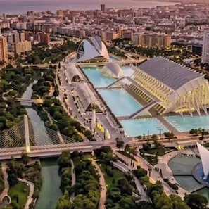 A large, modern architectural complex with multiple interconnected buildings and water features. - Mon Suites Marina (Valencia)