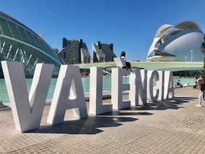 Large white letters spelling 'VALENCIA' on a paved surface. - Mon Suites Marina (Valencia)