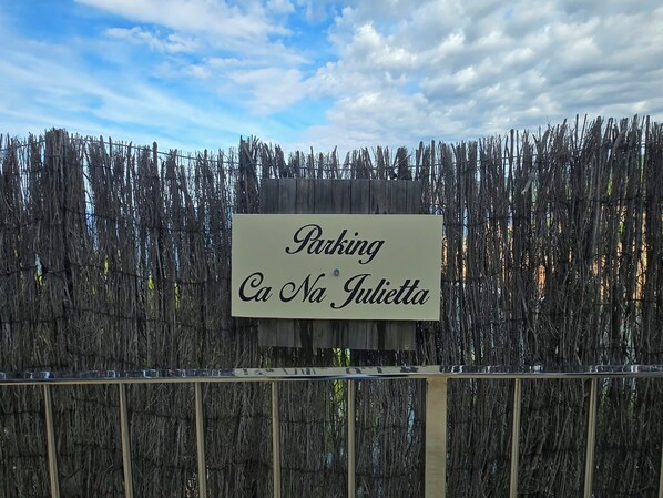 A sign indicating a parking area named 'Ca Na Giulietta.' - New Listing (Deià)