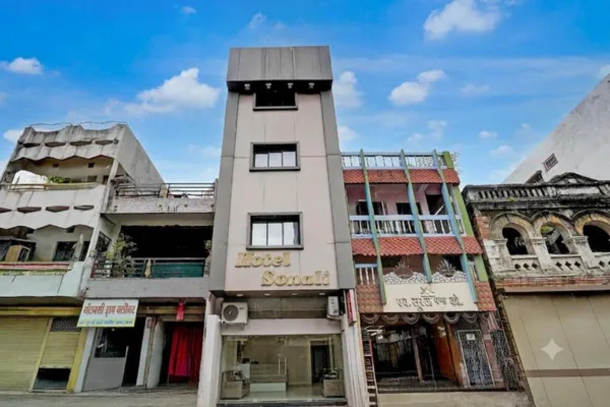 A hotel named 'Hotel Sonali' with a modern design, featuring a central tower and multiple balconies.