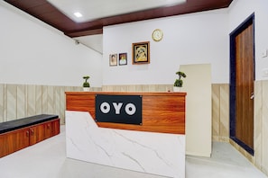 A reception desk with a sign reading 'OYO' in a modern interior. - Hotel O Brijbhav Vrindavan The Spiritual (Vrindavan)