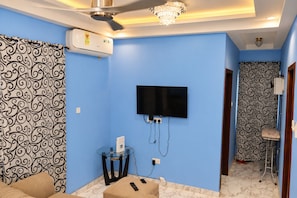 Living area - Alpha's Escape Wi-Fi TV Kitchen AC DSTV Ensuite Bath (Adenta Municipality)