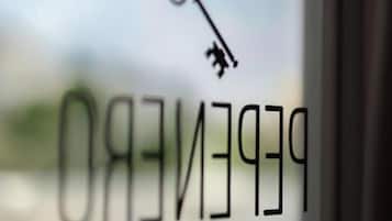 A key symbol above the text 'PEREIRO' and 'PEREIRO'S' on a window, indicating a hotel or property name.