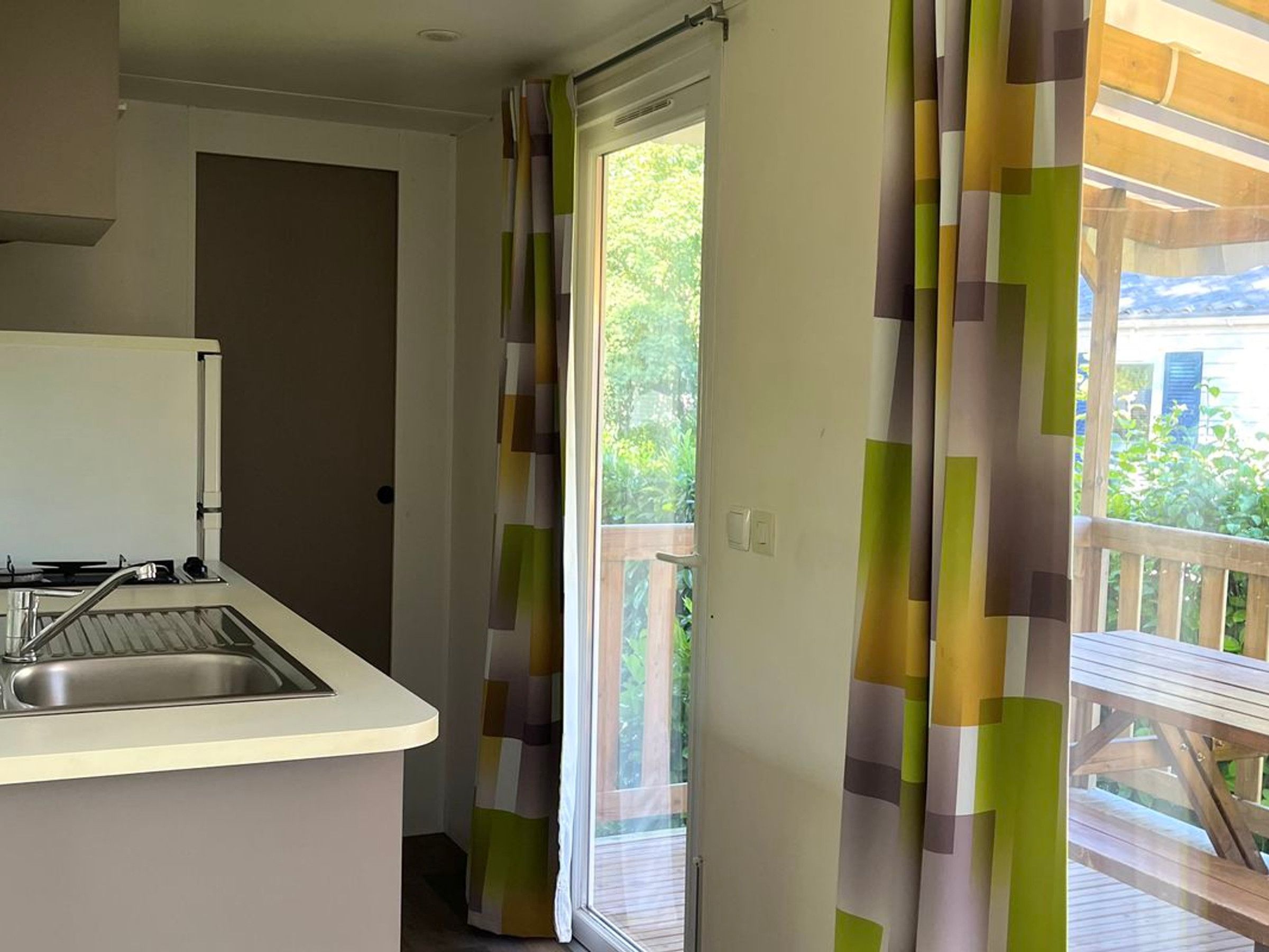 A kitchen with a sink and a window.