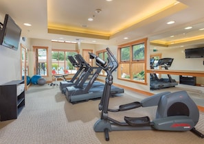 A gym with treadmills, elliptical machines, and exercise balls. - Chelan | Family Lake Retreat | Pool + Lake | 3BR Sleeps 8 (Chelan)