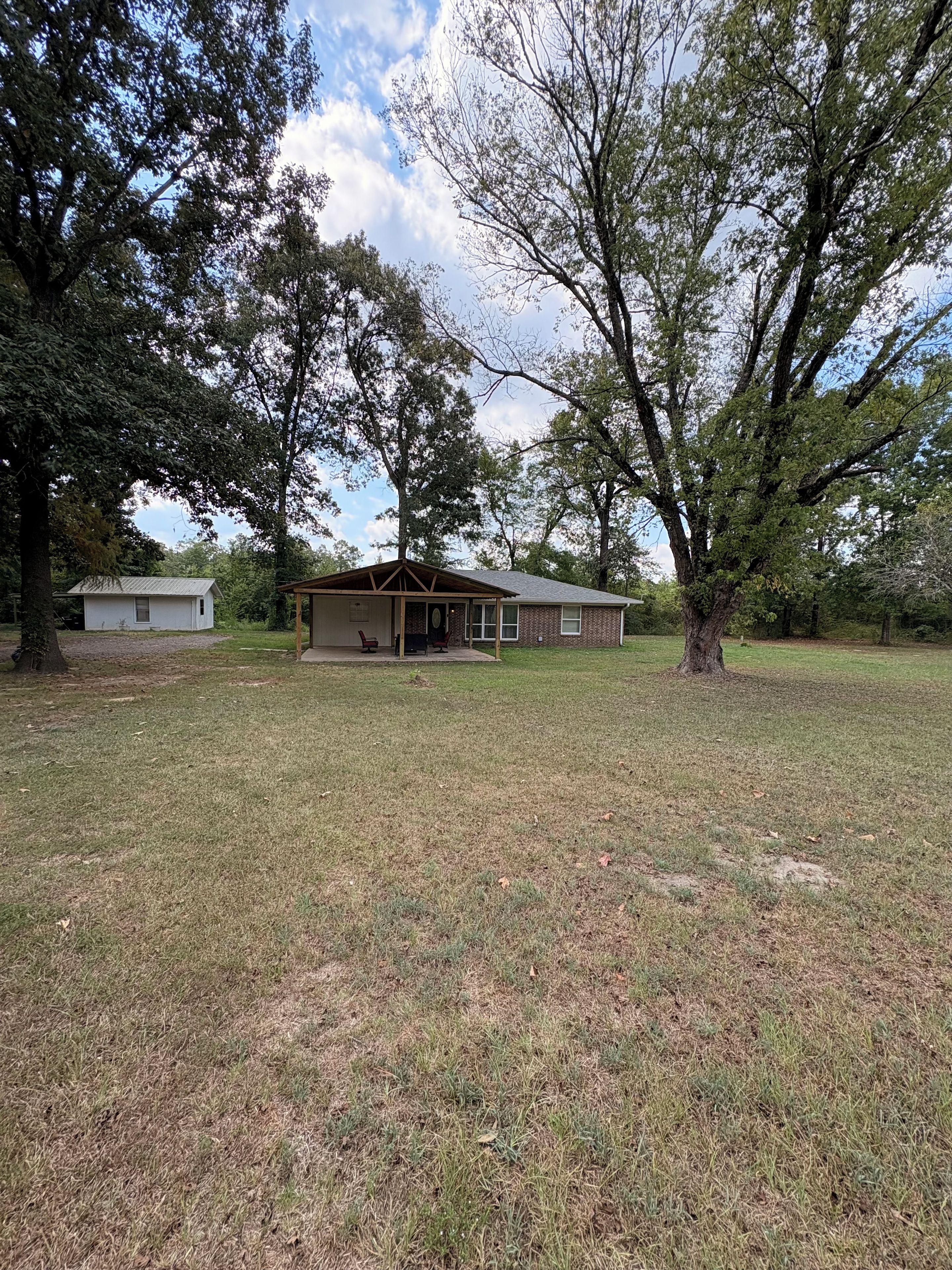 A single-story house with a porch and a small attached garage.
