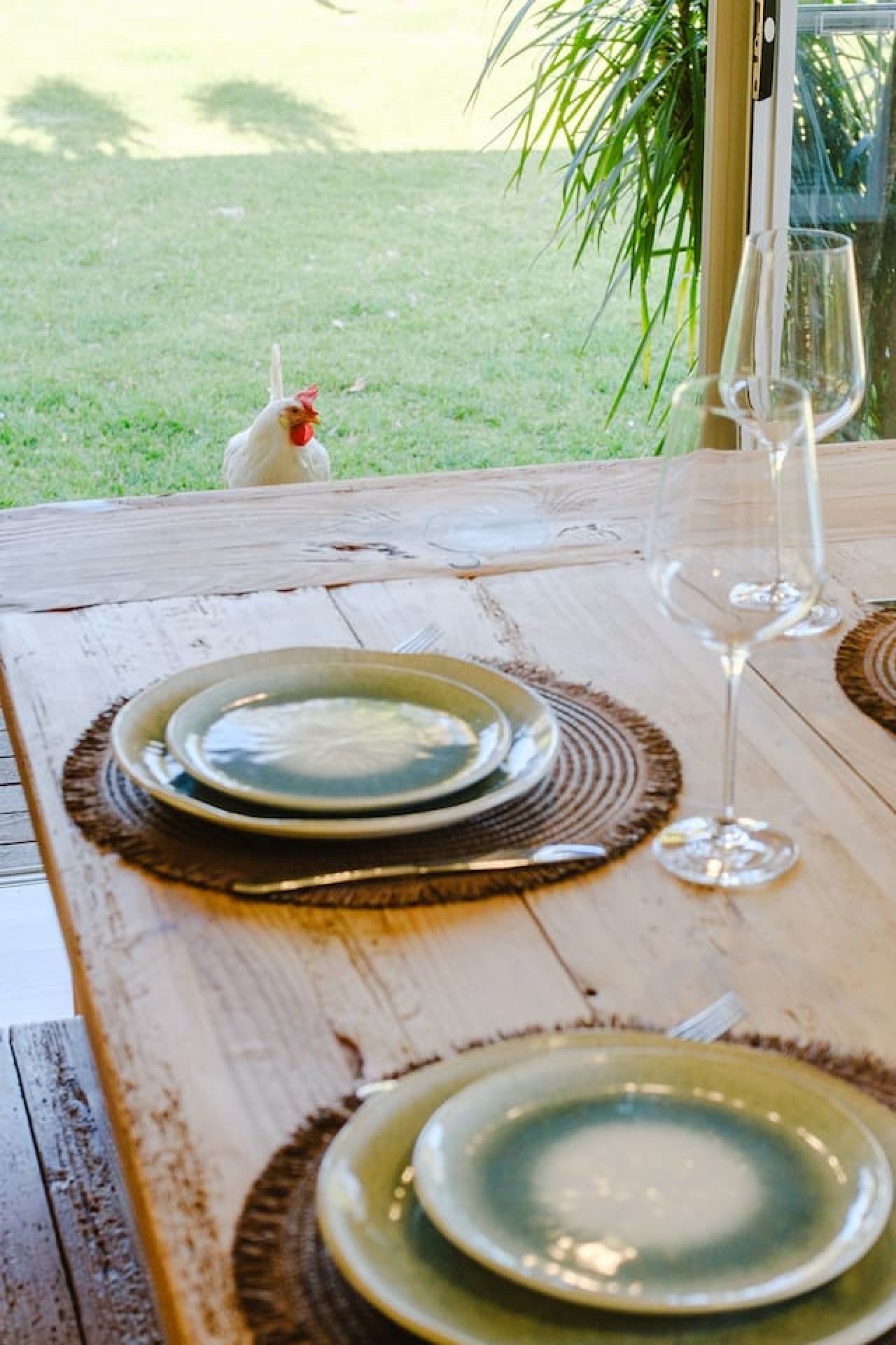 A table set for dining with plates, cutlery, and a glass.