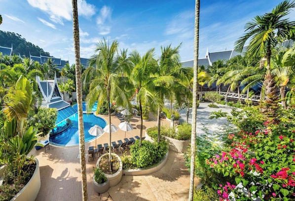 A resort with a swimming pool, lounge chairs, and tropical landscaping. - Executive Room1-Free Breakfast Early Check-in (Ao Nang)