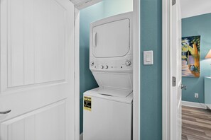 Keep laundry simple with a convenient stacked washer and dryer tucked into a compact closet. - Few Blocks to Beach • Pool Access + Golf Cart Zone | Beach Therapy (Port Aransas)