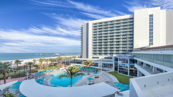 A hotel with a pool, beach view, and multiple floors. - Soak Up the Sunshine at Wyndham Clearwater Beach-1 Bedroom Deluxe (Clearwater)