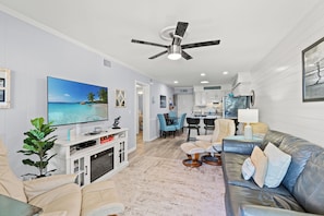 Deluxe Condo, 2 Bedrooms, Balcony, Partial Ocean View (106E) | Living area | TV - Ocean Forest Villas by Elliott Beach Rentals (Myrtle Beach)