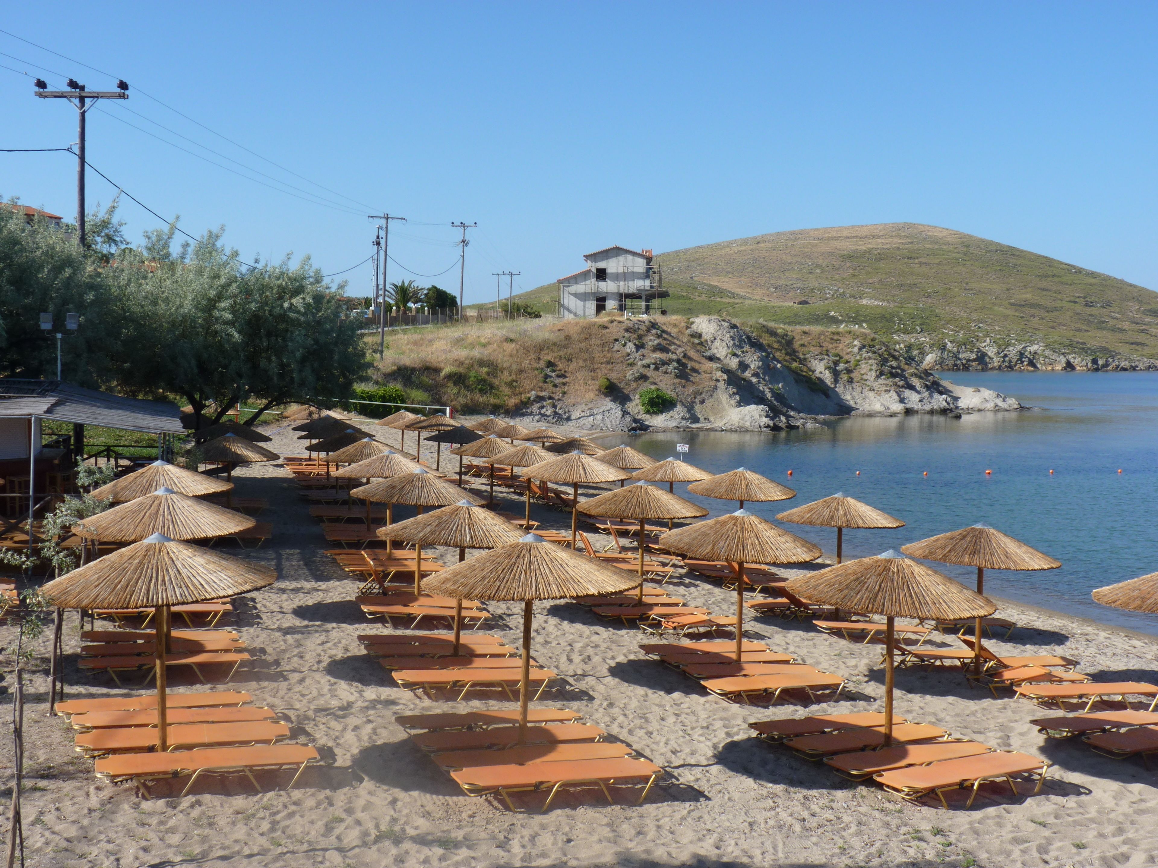 On the beach, sun-loungers, beach umbrellas, beach towels