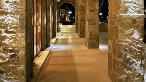A corridor with stone arches and lighting fixtures. - Lemnos Village Resort (Lemnos)