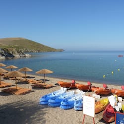 On the beach, sun-loungers, beach umbrellas, beach towels