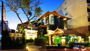 A multi-story building with a sign reading "YOTAKA RESIDENCE." - Yotaka Bangkok Hotel (Bangkok)