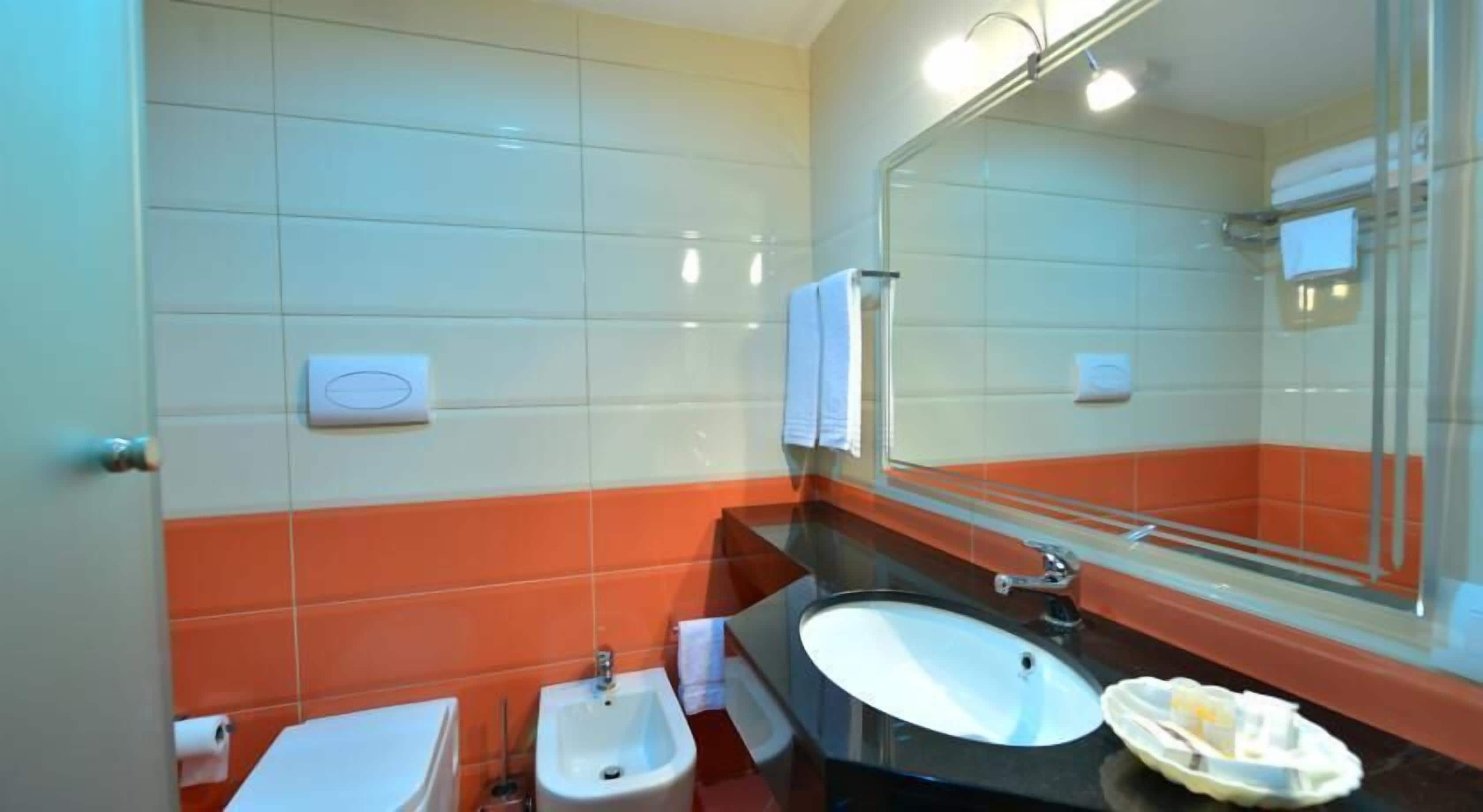 superior twin room | bathroom | shower, free toiletries, slippers, bidet