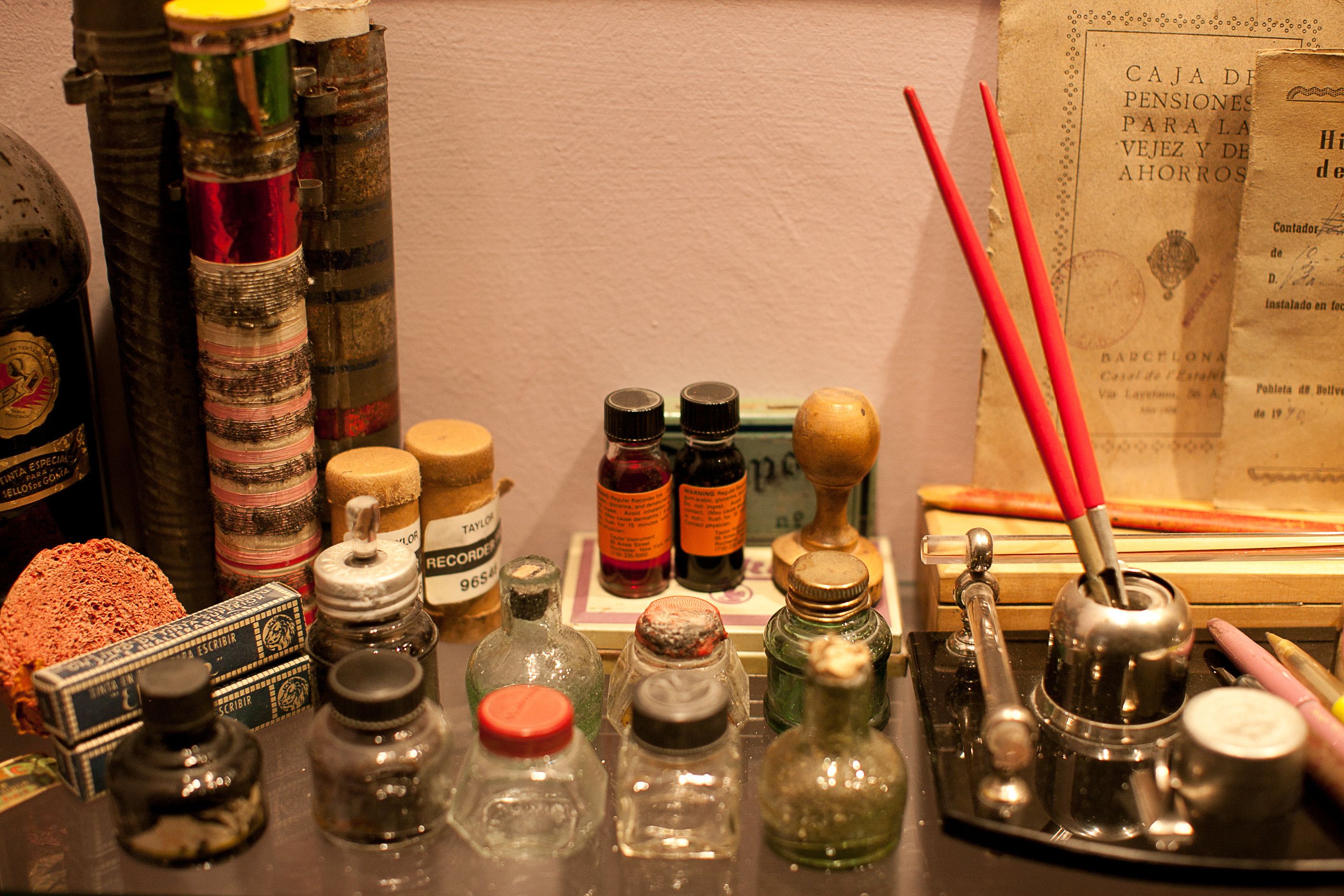 A collection of vintage bottles and containers, possibly for storage or dispensing, arranged on a surface.