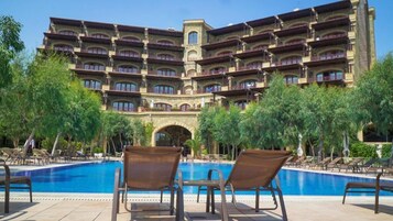 Outdoor pool, open 9:00 AM to 6:00 PM, pool umbrellas, pool loungers