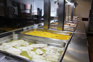 A buffet with various food options including fish and rice dishes. - Hotel Avanti (Pas de la Casa)