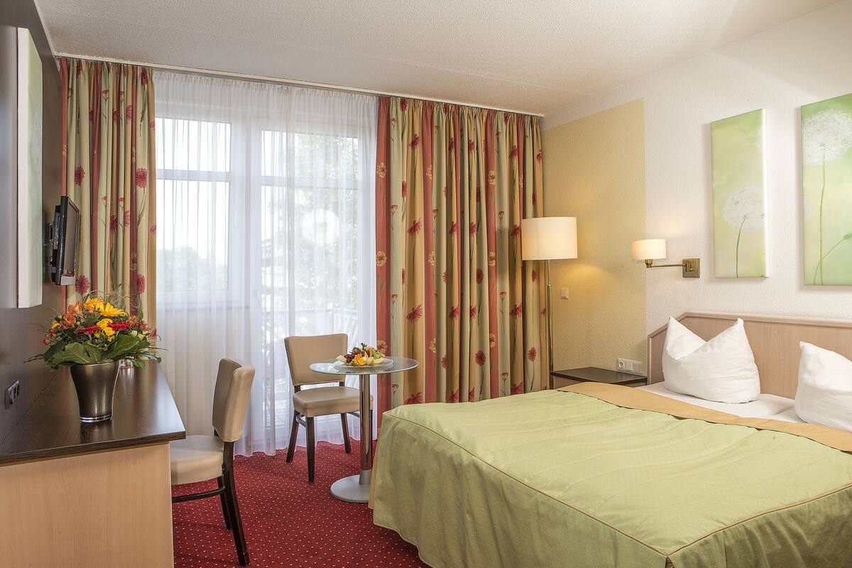 Double Room, Balcony | Living area | Flat-screen TV