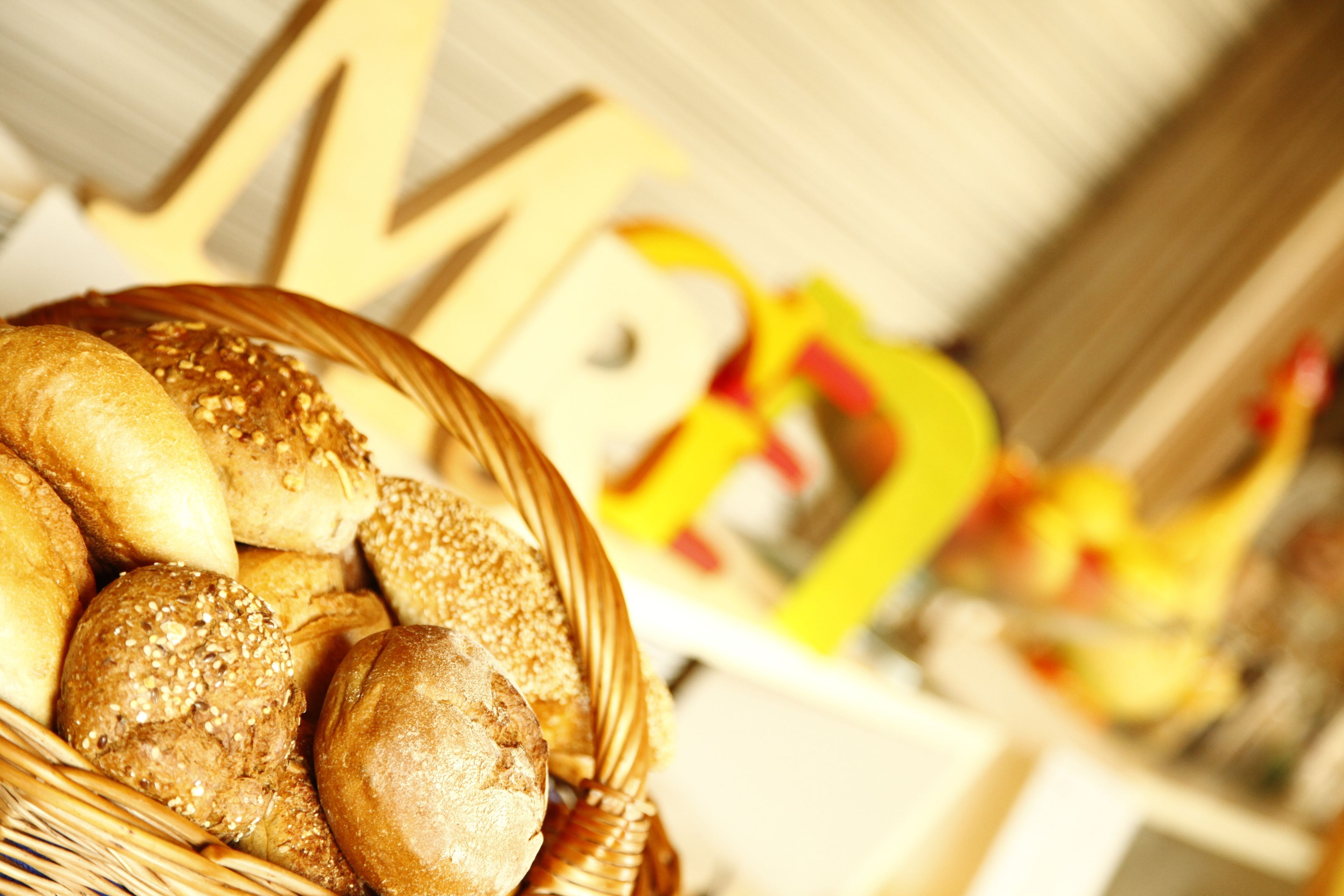 A basket of various breads and pastries.