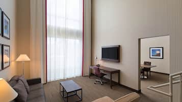 Suite, 1 Bedroom | Living area | 42-inch LCD TV with premium channels, TV, iPod dock