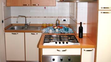 Apartment, 2 Bedrooms | Private kitchenette | Full-size fridge, microwave, oven, stovetop