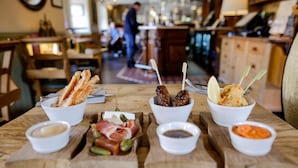 A wooden table with various food items and condiments. - The Plough Scalby (Scarborough)