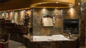 Waterfall hot tub suite with pool table, upgraded steam shower, sauna, and fireplace | Jetted tub