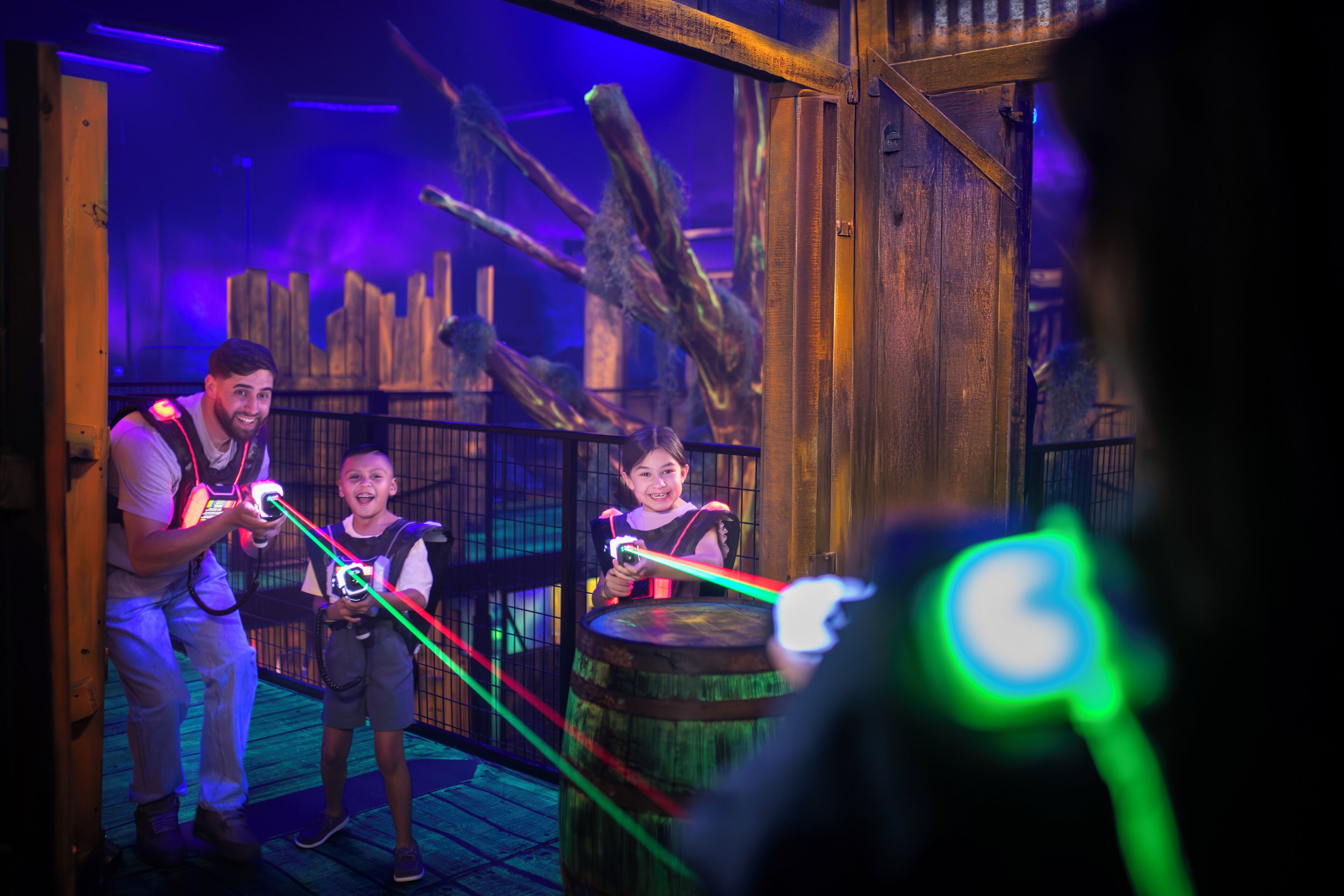 A wooden structure with a rustic design, possibly part of an attraction or themed area.