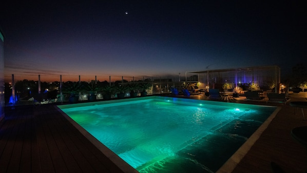 Outdoor pool, open 9:00 AM to 8:00 PM, pool umbrellas, pool loungers