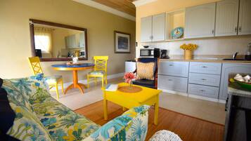 Ocean King Suite with Full Kitchen | Living area | 32-inch flat-screen TV with cable channels, TV, DVD player