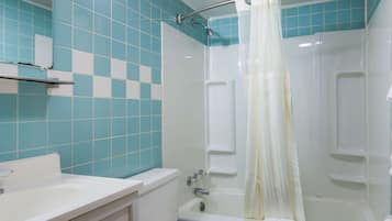 Suite, 1 King Bed, Jetted Tub | Bathroom | Combined shower/bathtub, free toiletries, towels, soap