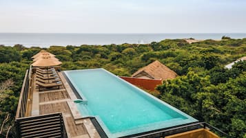 Outdoor pool, pool umbrellas, sun loungers