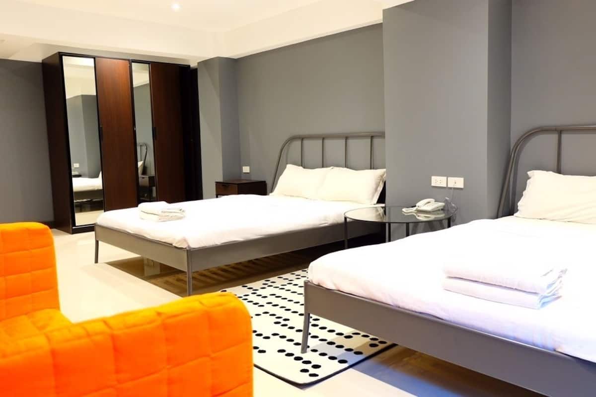 Family Room, 2 Double Beds | In-room safe, desk, free WiFi, bed sheets