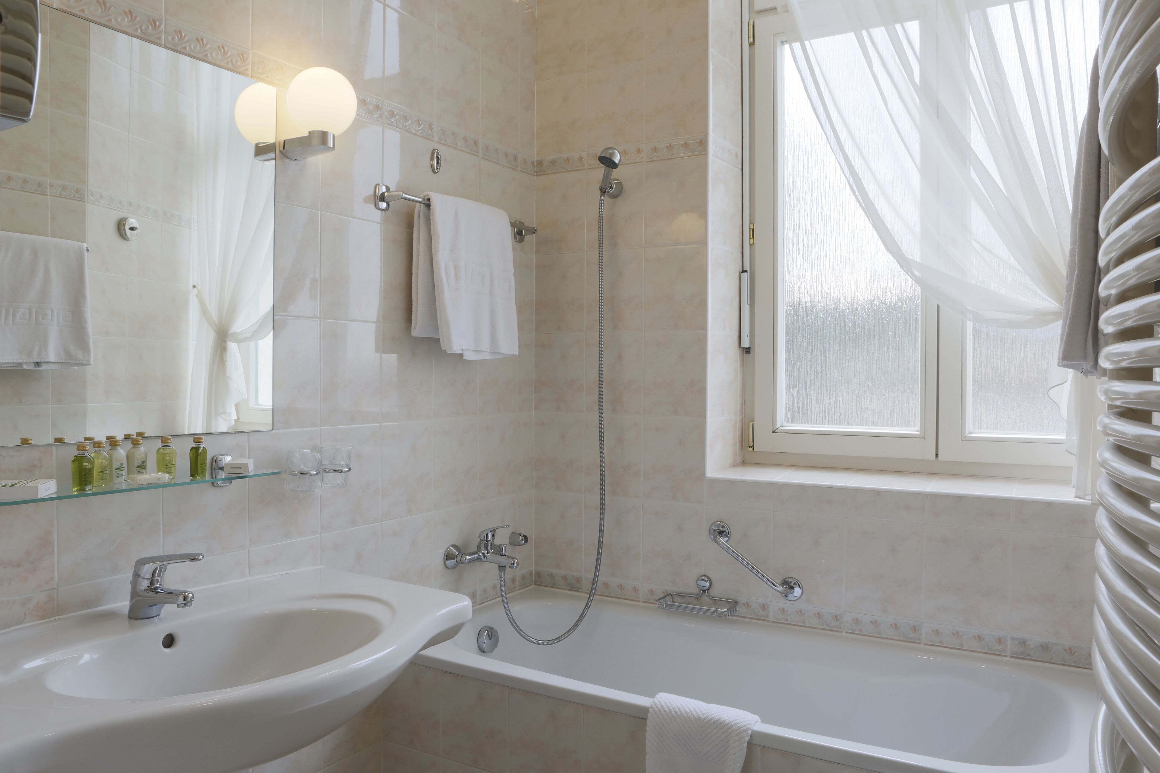 standard double room | bathroom | bathtub, designer toiletries, hair dryer, bathrobes
