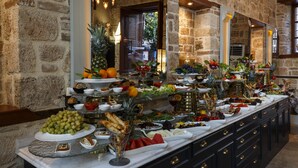 A buffet with a variety of fruits, vegetables, and breads. - Hotel 1207 Special Class (Antalya)