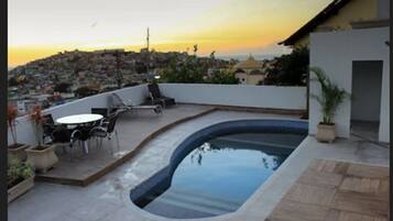 Enjoy a refreshing swim and take in the city views from the rooftop pool and surrounding terrace.