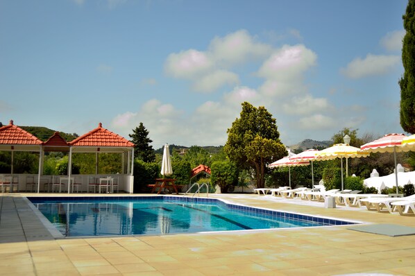 Outdoor pool, pool umbrellas, pool loungers