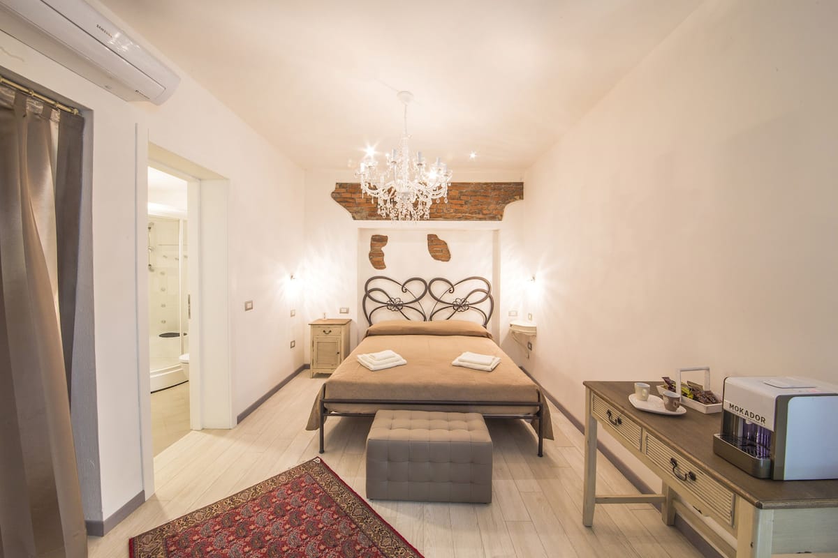 Quadruple Room, 1 Bedroom, Sauna, Ground Floor | Minibar, in-room safe, desk, soundproofing