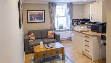 Standard-Apartment | Wohnbereich | Flachbildfernseher